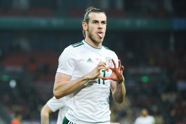 (CHINA,FRANCE,GERMANY OUT) NANNING, CHINA - MARCH 22:Gareth Bale of Wales national football team celebrates after scoring against Chinese national men's football team in the semi-final match during the 2018 Gree China Cup International Football Championship in Nanning city, south China's Guangxi Zhuang Autonomous Region, 22 March 2018.(Photo by Imaginechina/MB Media/Getty Images)