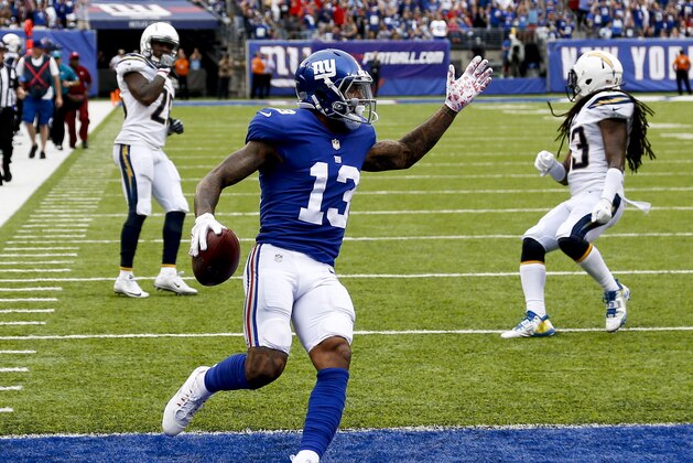 EAST RUTHERFORD, NJ - OCTOBER 08:  Odell Beckham #13 of the New York Giants runs in for a touchdown  during their game against Los Angeles Chargers at MetLife Stadium on October 8, 2017 in East Rutherford, New Jersey. (Photo by Jeff Zelevansky/Getty Images)