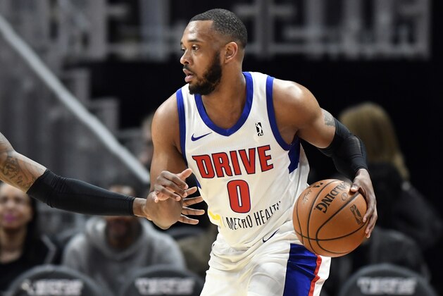 In a photo from Feb. 28, 2018, Grand Rapids Drive forward Zeke Upshaw looks to pass during a basketball game in Detroit. Upshaw, the Detroit Pistons developmental player who collapsed on the court during a NBA G League game in Michigan has died. The Grand Rapids Drive says 26-year-old Upshaw died at a hospital Monday, March 26, 2018. No cause was disclosed. (AP Photo/Jose Juarez)