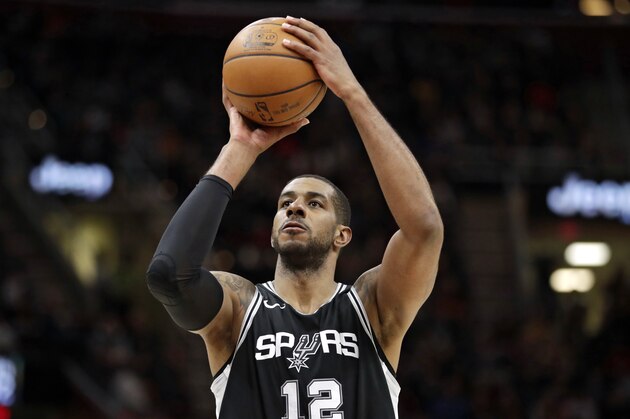 San Antonio Spurs' LaMarcus Aldridge shoots against the Cleveland Cavaliers in the first half of an NBA basketball game, Sunday, Feb. 25, 2018, in Cleveland. (AP Photo/Tony Dejak)
