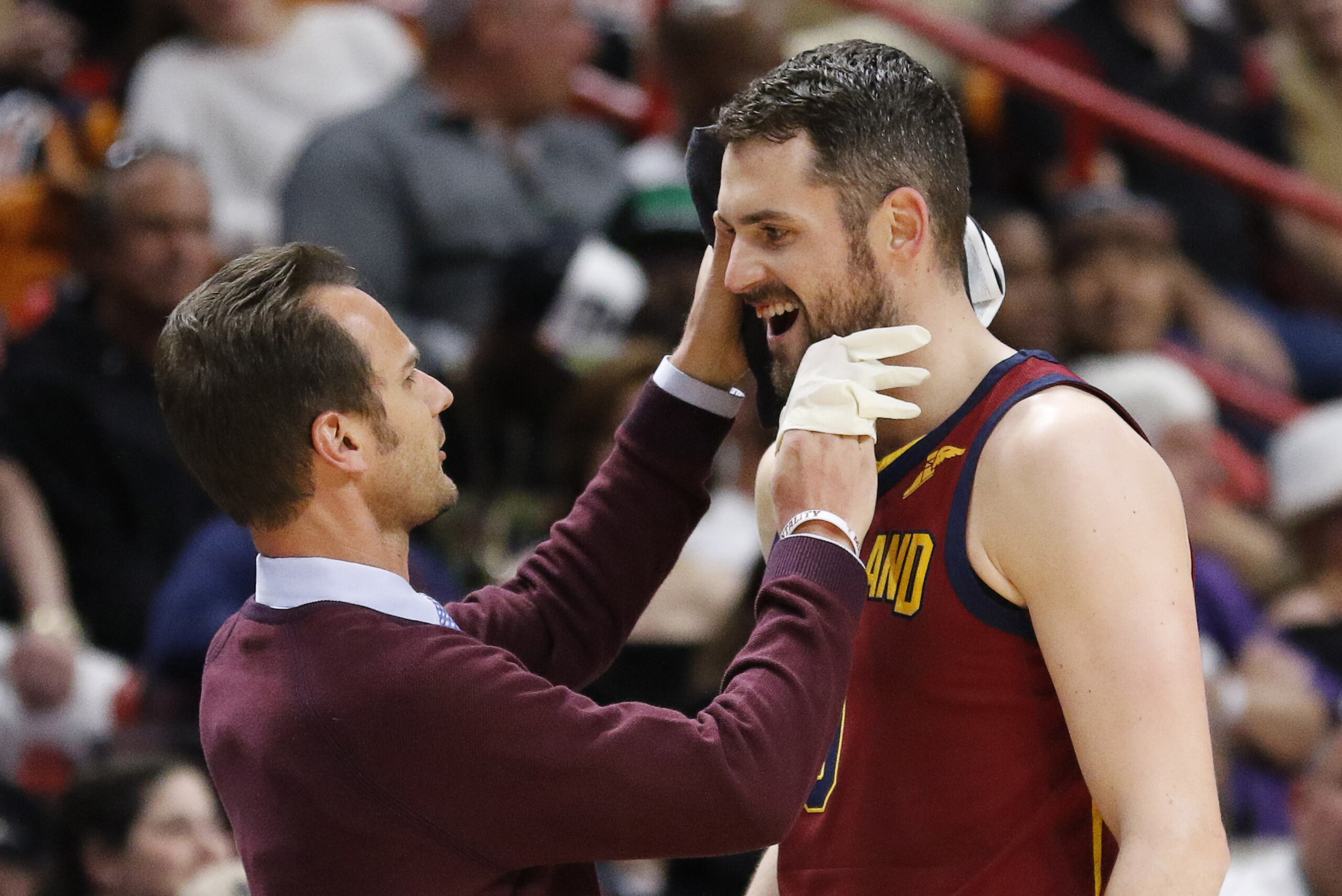 Cleveland Cavaliers center Kevin Love (0) is attended to after a first quarter injury during play against the Miami Heat in an NBA basketball game, Tuesday, March 27, 2018, in Miami. The Heat won the game 98-79. (AP Photo/Joe Skipper)