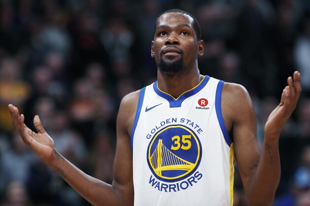 Golden State Warriors forward Kevin Durant reacts to calls from fans at the close of the team's NBA basketball game against the Denver Nuggets on Saturday, Feb. 3, 2018, in Denver. The Nuggets won 115-108. (AP Photo/David Zalubowski)
