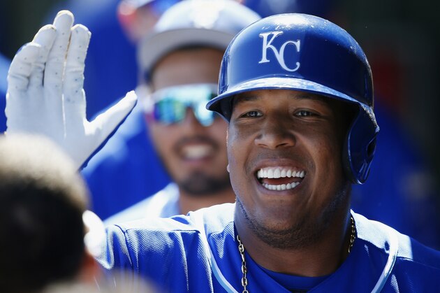 Kansas City Royals' Salvador Perez smiles as he celebrates his run scored against the San Diego Padres during the third inning of a spring training baseball game Monday, March 12, 2018, in Surprise, Ariz. The Royals defeated the Padres 4-0. (AP Photo/Ross D. Franklin)