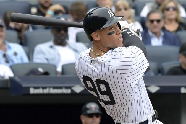 FILE - In this Wednesday, Sept. 20, 2017 file photo, New York Yankees' Aaron Judge follows through on a two-run home run during the third inning of a baseball game against the Minnesota Twins at Yankee Stadium in New York. Yankees slugger Aaron Judge is a finalist for AL MVP and Rookie of the Year, giving him a chance to become just the third player to win the awards in the same year. The Baseball Writers’ Association of America revealed the finalists for its major awards on Monday night, Nov. 6, 2017. (AP Photo/Bill Kostroun, File) FILE - In this Wednesday, Sept. 20, 2017 file photo, New York Yankees' Aaron Judge follows through on a two-run home run during the third inning of a baseball game against the Minnesota Twins at Yankee Stadium in New York. Yankees slugger Aaron Judge is a finalist for AL MVP and Rookie of the Year, giving him a chance to become just the third player to win the awards in the same year. The Baseball Writers’ Association of America revealed the finalists for its major awards on Monday night, Nov. 6, 2017. (AP Photo/Bill Kostroun, File)