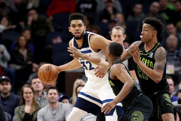 MINNEAPOLIS, MN - MARCH 28: Karl-Anthony Towns #32 of the Minnesota Timberwolves handles the ball against the Atlanta Hawks on March 28, 2018 at Target Center in Minneapolis, Minnesota. NOTE TO USER: User expressly acknowledges and agrees that, by downloading and or using this Photograph, user is consenting to the terms and conditions of the Getty Images License Agreement. Mandatory Copyright Notice: Copyright 2018 NBAE (Photo by Jordan Johnson/NBAE via Getty Images)