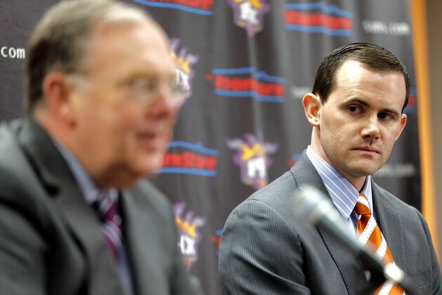 Phoenix Suns president of basketball operations Lon Babby, left, introduces the team's newd general manager Ryan McDonough during an NBA basketball news conference, Thursday, May 9, 2013, in Phoenix.  McDonough joins the Suns after most recently serving the past three seasons as the assistant general manager of the Boston Celtics.  (AP Photo/Matt York)