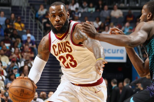 CHARLOTTE, NC - MARCH 28:  LeBron James #23 of the Cleveland Cavaliers handles the ball against the Charlotte Hornets on March 28, 2018 at Spectrum Center in Charlotte, North Carolina. NOTE TO USER: User expressly acknowledges and agrees that, by downloading and or using this photograph, User is consenting to the terms and conditions of the Getty Images License Agreement.  Mandatory Copyright Notice: Copyright 2018 NBAE (Photo by Brock Williams-Smith/NBAE via Getty Images)