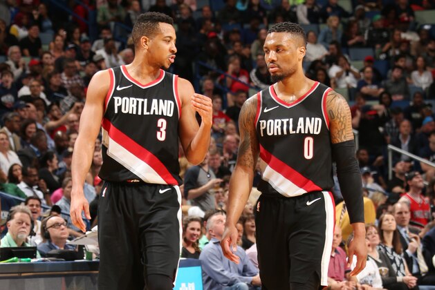 NEW ORLEANS, LA - MARCH 27:  CJ McCollum #3 and Damian Lillard #0 of the Portland Trail Blazers look on during the game against the New Orleans Pelicans on March 27, 2018 at the Smoothie King Center in New Orleans, Louisiana. NOTE TO USER: User expressly acknowledges and agrees that, by downloading and or using this Photograph, user is consenting to the terms and conditions of the Getty Images License Agreement. Mandatory Copyright Notice: Copyright 2018 NBAE (Photo by Layne Murdoch/NBAE via Getty Images)