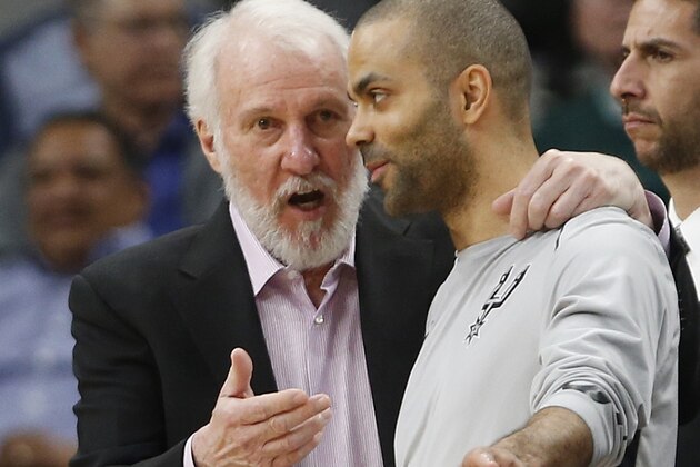 SAN ANTONIO,TX - MARCH 15:  Gregg Popvich head coach of the San Antonio Spurs talks with Tony Parker #9 of the San Antonio Spurs during game against the New Orleans Pelicans at AT&T Center on March 15, 2018  in San Antonio, Texas.  NOTE TO USER: User expressly acknowledges and agrees that , by downloading and or using this photograph, User is consenting to the terms and conditions of the Getty Images License Agreement. (Photo by Ronald Cortes/Getty Images)