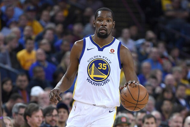 OAKLAND, CA - MARCH 14:  Kevin Durant #35 of the Golden State Warriors dribbles the ball up court against the Los Angeles Lakers during an NBA basketball game at ORACLE Arena on March 14, 2018 in Oakland, California. NOTE TO USER: User expressly acknowledges and agrees that, by downloading and or using this photograph, User is consenting to the terms and conditions of the Getty Images License Agreement.  (Photo by Thearon W. Henderson/Getty Images)