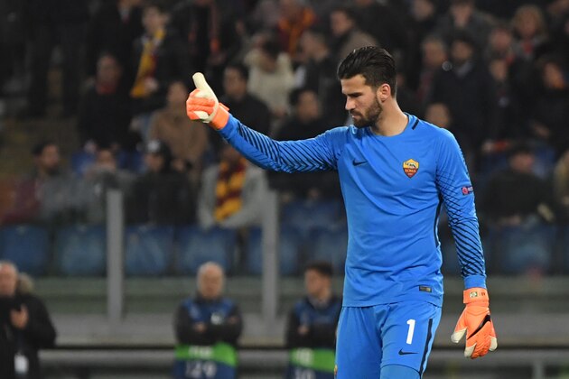 Roma's Brazilian goalkeeper Alisson celebrates afer winning 1-0 the UEFA Champions League round of 16 second leg football match AS Roma vs Shakhtar Donetsk on March 13, 2018 at the Olympic stadium in Rome. 
Roma reached the Champions League quarter-finals for the first time in 10 years as Edin Dzeko edged them past Shakhtar Donetsk 1-0 at the Stadio Olimpico on Tuesday for an away goals victory. / AFP PHOTO / Andreas SOLARO        (Photo credit should read ANDREAS SOLARO/AFP/Getty Images)