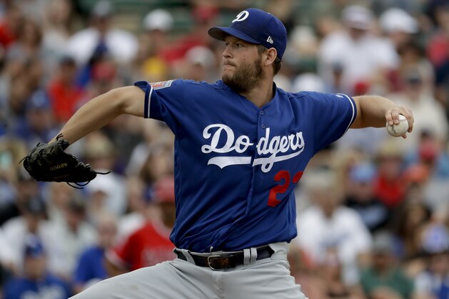 Los Angeles Dodgers starting pitcher Clayton Kershaw throws against the Los Angeles Angels during the first inning of a spring baseball game in Tempe, Ariz., Wednesday, March 7, 2018. (AP Photo/Chris Carlson)