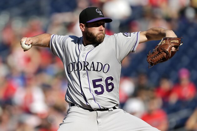 Colorado Rockies relief pitcher Greg Holland pitches during a baseball game between the Colorado Rockies and Washington Nationals, Sunday, July 30, 2017, in Washington. (AP Photo/Mark Tenally)