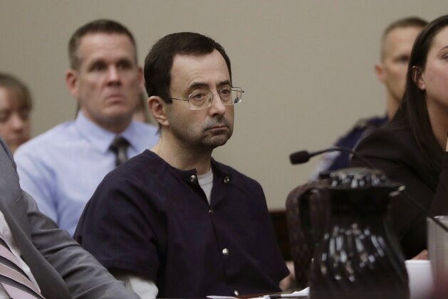 FILE - In this Wednesday, Jan. 24, 2018 file photo, Larry Nassar sits during his sentencing hearing in Lansing, Mich. Nassar, a 54-year-old former doctor for USA Gymnastics and member of Michigan State's sports medicine staff, admitted to molesting athletes while he was supposedly treating them for injuries. Nassar was the U.S. national team’s doctor from 1995 to 2015. (AP Photo/Carlos Osorio, File)