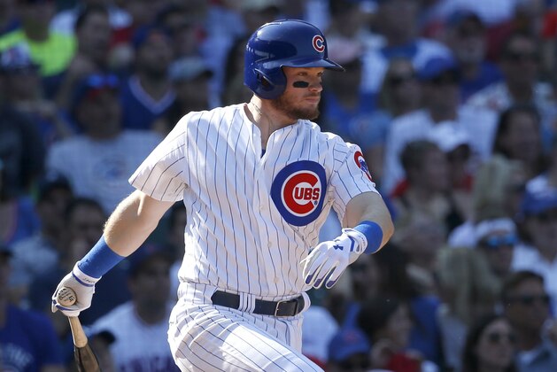 Chicago Cubs' Ian Happ watches his two-run single off St. Louis Cardinals relief pitcher Matt Bowman in the sixth inning of a baseball game Friday, Sept. 15, 2017, in Chicago. Jon Jay and Jason Heyward scored on the play. (AP Photo/Charles Rex Arbogast)