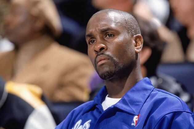 OAKLAND, CA - DECEMBER 23:  Gary Payton #20 of the Los Angeles Lakers looks on from the bench during the game against the Golden State Warriors on December 23, 2003 at the Arena in Oakland, California. The Warriors won 107-98.  NOTE TO USER: User expressly acknowledges and agrees that, by downloading and/or using this Photograph, User is consenting to the terms and conditions of the Getty Images License Agreement (Photo by Rocky Widner/NBAE via Getty Images)