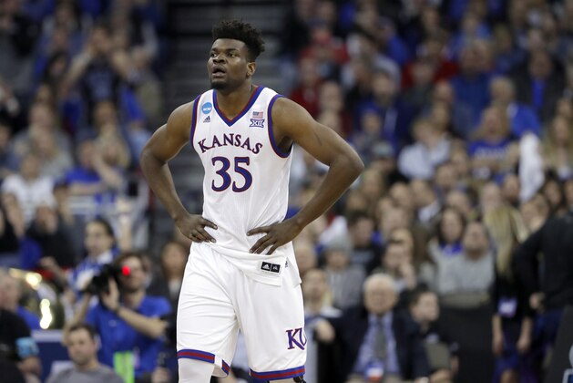 Kansas' Udoka Azubuike pauses during the second half of a regional final game against Duke in the NCAA men's college basketball tournament Sunday, March 25, 2018, in Omaha, Neb. (AP Photo/Charlie Neibergall)