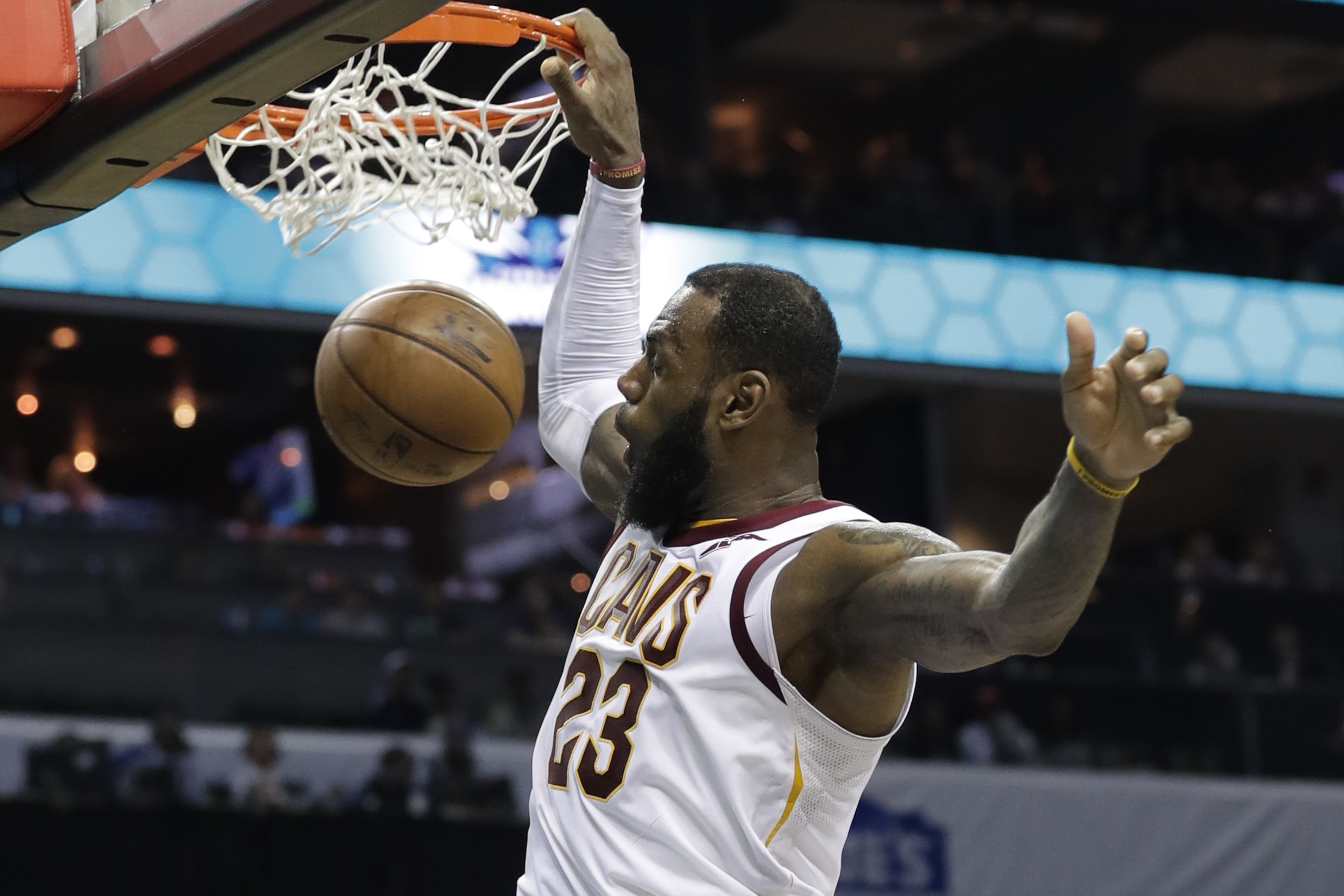 Cleveland Cavaliers' LeBron James (23) dunks against the Charlotte Hornets during the second half of an NBA basketball game in Charlotte, N.C., Wednesday, March 28, 2018. (AP Photo/Chuck Burton)