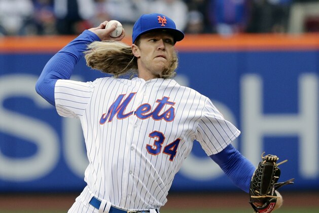 New York Mets' Noah Syndergaard (34) delivers a pitch during the first inning of a baseball game against the St. Louis Cardinals Thursday, March 29, 2018, in New York. (AP Photo/Frank Franklin II)