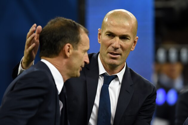 CARDIFF, WALES - JUNE 03: Head coach Zinedine Zidane of Real Madrid consoles head coach Massimiliano Allegri of Juventus after the UEFA Champions League final match between Juventus and Real Madrid at National Stadium of Wales on June 3, 2017 in Cardiff, Wales. (Photo by Etsuo Hara/Getty Images)