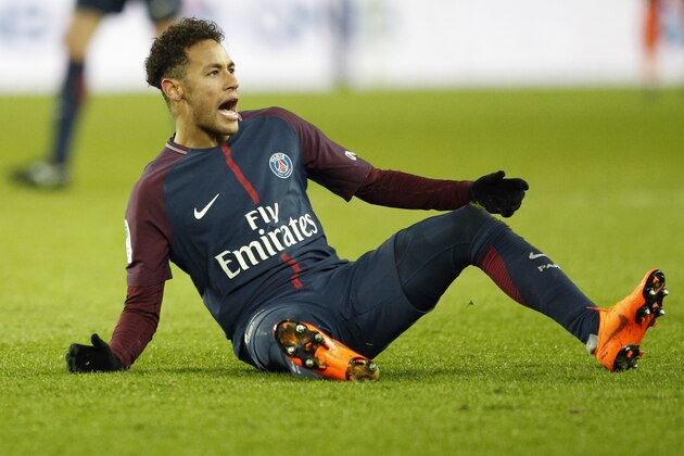PSG's Neymar reacts after falling during the French League One soccer match between Paris Saint Germain and Strasbourg, at the Parc des Princes stadium in Paris, France, Saturday, Feb. 17, 2018. (AP Photo/Francois Mori)