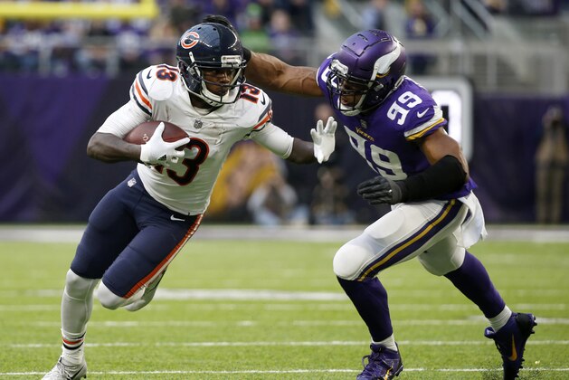 Chicago Bears wide receiver Kendall Wright (13) runs from Minnesota Vikings defensive end Danielle Hunter (99) after making a reception during the second half of an NFL football game, Sunday, Dec. 31, 2017, in Minneapolis. (AP Photo/Bruce Kluckhohn)