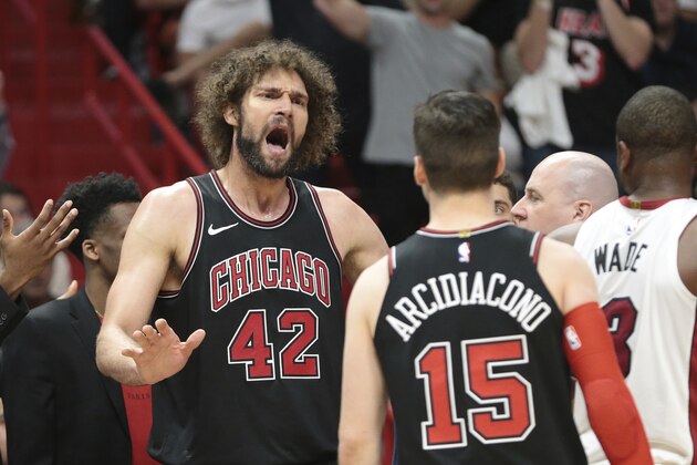 Chicago Bulls center Robin Lopez (42) reacts after receiving two technical fouls and being ejected from an NBA basketball game against the Miami Heat during the second half Thursday, March 29, 2018, in Miami. (AP Photo/Joel Auerbach)