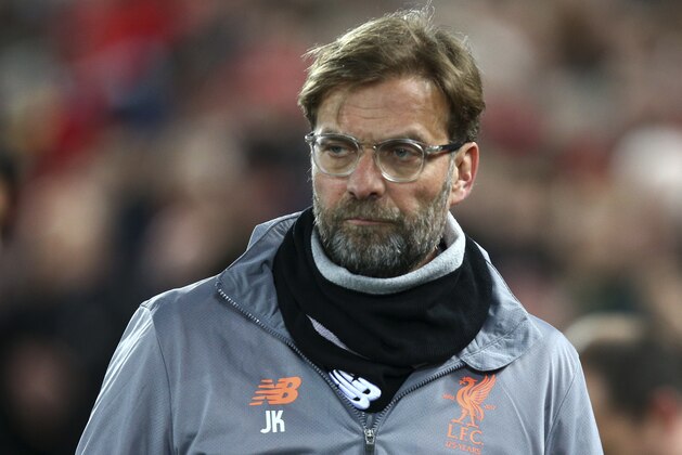 Liverpool coach Jurgen Klopp enters the field for the Champions League round of 16, second leg, soccer match between Liverpool and FC Porto at Anfield Stadium, Liverpool, England, Tuesday March 6, 2018. (AP Photo/Dave Thompson)