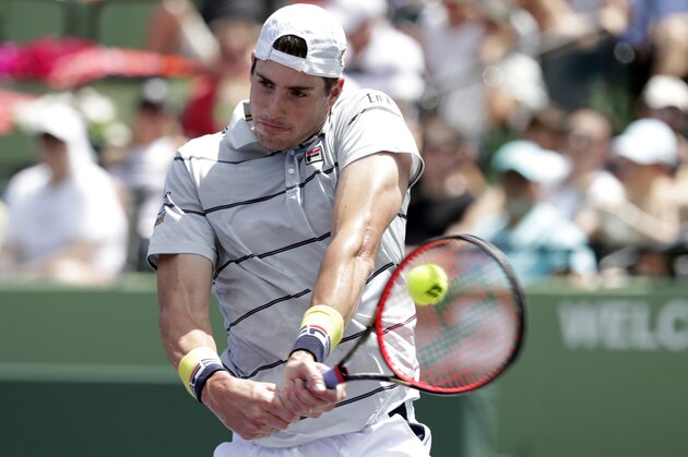 John Isner returns to Juan Martin del Potro, of Argentina, during a semifinal at the Miami Open tennis tournament, Friday, March 30, 2018, in Key Biscayne, Fla. Isner won 6-1, 7-6 (2). (AP Photo/Lynne Sladky)