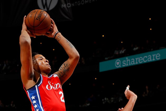 ATLANTA, GA - MARCH 30:  Markelle Fultz #20 of the Philadelphia 76ers drives for a dunk against Damion Lee #8 of the Atlanta Hawks at Philips Arena on March 30, 2018 in Atlanta, Georgia.  NOTE TO USER: User expressly acknowledges and agrees that, by downloading and or using this photograph, User is consenting to the terms and conditions of the Getty Images License Agreement.  (Photo by Kevin C. Cox/Getty Images)