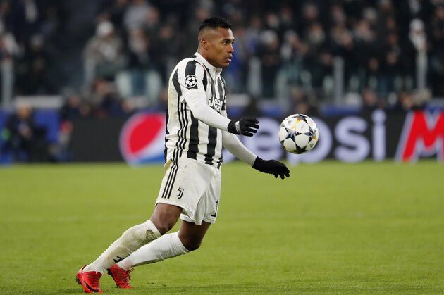 Juventus' Alex Sandro controls the ball during the Champions League, round of 16, first-leg soccer match between Juventus and Tottenham Hotspurs, at the Allianz Stadium in Turin, Italy, Tuesday, Feb. 13, 2018. (AP Photo/Antonio Calanni)