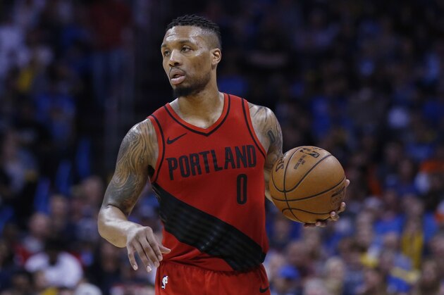 Portland Trail Blazers guard Damian Lillard (0) during an NBA basketball game against the Oklahoma City Thunder in Oklahoma City, Sunday, March 25, 2018. (AP Photo/Sue Ogrocki)