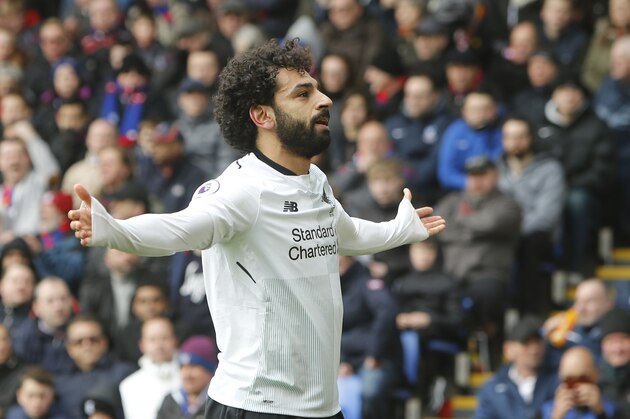 Liverpool's Mohamed Salah celebrates after soring his sides second goal of the gameduring their English Premier League soccer match between Crystal Palace and Liverpool at Selhurst Park stadium in London, Saturday, March, 31, 2018. Liverpool won the game 2-1. (AP Photo/Alastair Grant)