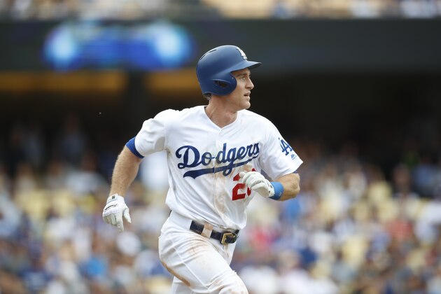 Los Angeles Dodgers' Chase Utley watches his solo home run during the fifth inning of a baseball game against the Cincinnati Reds, Sunday, June 11, 2017, in Los Angeles. (AP Photo/Ryan Kang)
