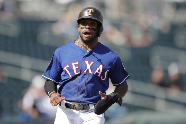 Texas Rangers' Delino DeShields runs to home plate during the third inning of a spring training baseball game against the San Diego Padres, Thursday, March 1, 2018, in Surprise, Ariz. (AP Photo/Charlie Neibergall)