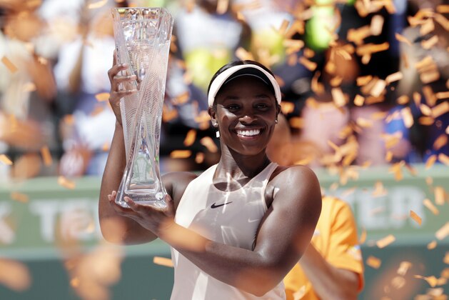 Sloane Stephens holds her trophy after defeating Jelena Ostapenko, of Latvia, in the final of the Miami Open tennis tournament, Saturday, March 31, 2018, in Key Biscayne, Fla. Stephens won 7-6 (5), 6-1. (AP Photo/Lynne Sladky)