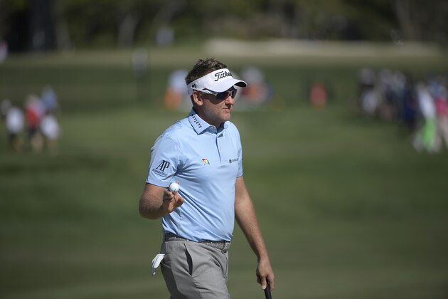 Ian Poulter, of England, acknowledges the crowd after making a putt on the 14th green during the second round of the Arnold Palmer Invitational golf tournament Friday, March 16, 2018, in Orlando, Fla. (AP Photo/Phelan M. Ebenhack)