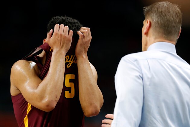 Loyola-Chicago guard Marques Townes, left, reacts in front of head coach Porter Moser during the second half against Michigan in the semifinals of the Final Four NCAA college basketball tournament, Saturday, March 31, 2018, in San Antonio. (AP Photo/Charlie Neibergall)