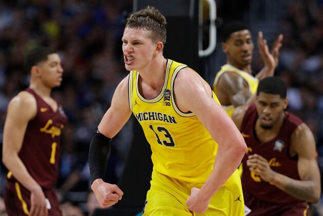 Michigan's Moritz Wagner (13) reacts during the first half in the semifinals of the Final Four NCAA college basketball tournament against Loyola-Chicago , Saturday, March 31, 2018, in San Antonio. (AP Photo/David J. Phillip)