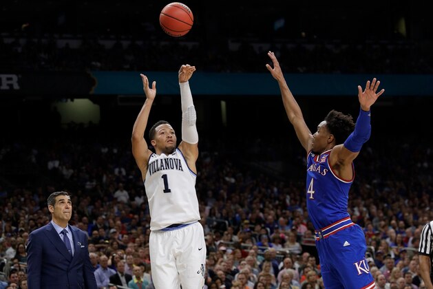 Villanova's Jalen Brunson (1) shoots a 3-point basket against Kansas's Devonte' Graham (4) during the second half in the semifinals of the Final Four NCAA college basketball tournament, Saturday, March 31, 2018, in San Antonio. (AP Photo/David J. Phillip)
