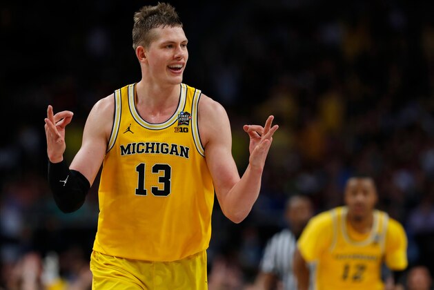Michigan's Moritz Wagner (13) reacts after scoring a 3-point shot against Loyola-Chicago during the second half in the semifinals of the Final Four NCAA college basketball tournament, Saturday, March 31, 2018, in San Antonio. (AP Photo/Charlie Neibergall)