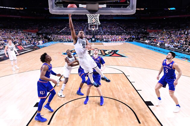 SAN ANTONIO, TX - MARCH 31: Phil Booth #5 of the Villanova Wildcats drives to the basket in the second half against Devonte' Graham #4 of the Kansas Jayhawks in the 2018 NCAA Men's Final Four semifinal game at the Alamodome on March 31, 2018 in San Antonio, Texas.  (Photo by Jamie Schwaberow - Pool/Getty Images)