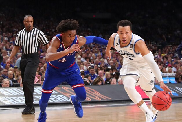 SAN ANTONIO, TX - MARCH 31:  Jalen Brunson #1 of the Villanova Wildcats is defended by Devonte' Graham #4 of the Kansas Jayhawks in the second half during the 2018 NCAA Men's Final Four Semifinal at the Alamodome on March 31, 2018 in San Antonio, Texas.  (Photo by Tom Pennington/Getty Images)