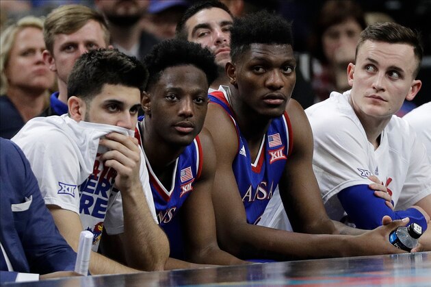 Kansas players watches from the bench during the second half in the semifinals of the Final Four NCAA college basketball tournament against Villanova, Saturday, March 31, 2018, in San Antonio. (AP Photo/David J. Phillip)