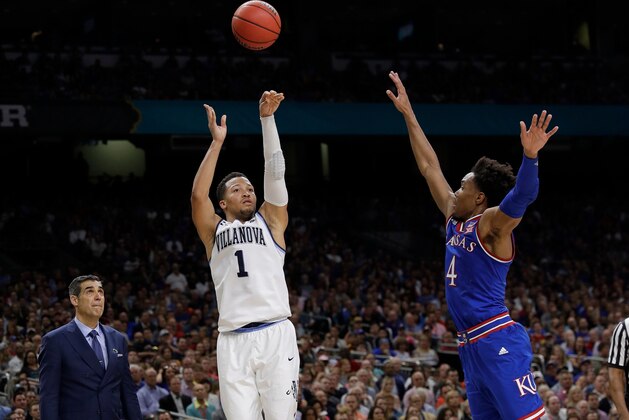 Villanova's Jalen Brunson (1) shoots a 3-point basket against Kansas's Devonte' Graham (4) during the second half in the semifinals of the Final Four NCAA college basketball tournament, Saturday, March 31, 2018, in San Antonio. (AP Photo/David J. Phillip)