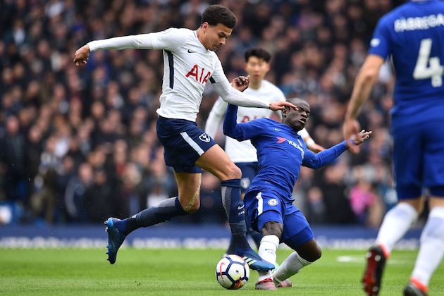 Tottenham Hotspur's English midfielder Dele Alli (L) is tackled by Chelsea's French midfielder N'Golo Kante during the English Premier League football match between Chelsea and Tottenham Hotspur at Stamford Bridge in London on April 1, 2018. / AFP PHOTO / Glyn KIRK / RESTRICTED TO EDITORIAL USE. No use with unauthorized audio, video, data, fixture lists, club/league logos or 'live' services. Online in-match use limited to 75 images, no video emulation. No use in betting, games or single club/league/player publications.  /         (Photo credit should read GLYN KIRK/AFP/Getty Images)