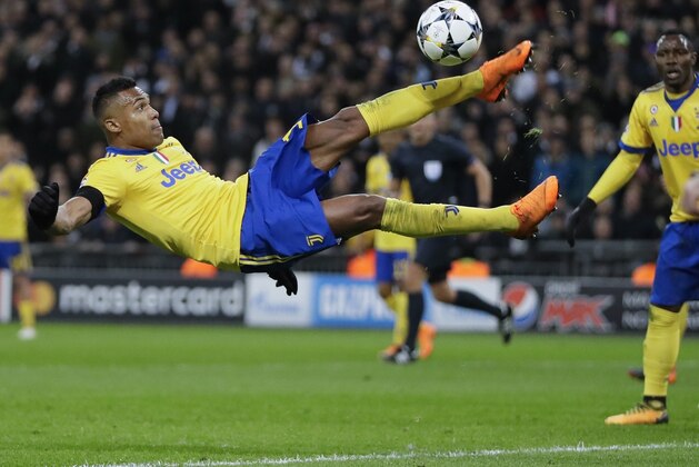 Juventus' Alex Sandro performs an acrobatic kick during the Champions League, round of 16, second-leg soccer match between Juventus and Tottenham Hotspur, at the Wembley Stadium in London, Wednesday, March 7, 2018. (AP Photo/Kirsty Wigglesworth)