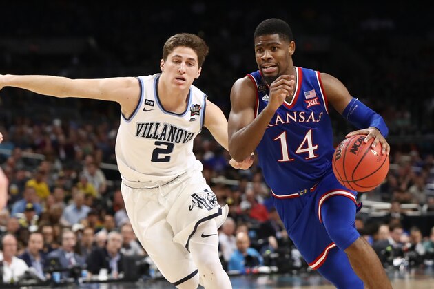 SAN ANTONIO, TX - MARCH 31: Malik Newman #14 of the Kansas Jayhawks is defended by Collin Gillespie #2 of the Villanova Wildcats during the 2018 NCAA Men's Final Four Semifinal at the Alamodome on March 31, 2018 in San Antonio, Texas. The Villanova Wildcats defeated the Kansas Jayhawks 95-79.  (Photo by Ronald Martinez/Getty Images)