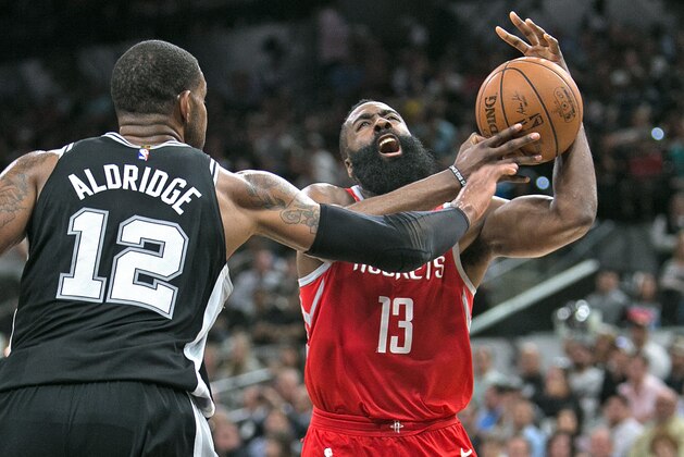 SAN ANTONIO,TX - APRIL 1 :  James Harden #13 of the Houston Rockets has his shot blocked by LaMarcus Aldridge #12 of the San Antonio Spurs at AT&T Center on April 1 , 2018  in San Antonio, Texas.  NOTE TO USER: User expressly acknowledges and agrees that , by downloading and or using this photograph, User is consenting to the terms and conditions of the Getty Images License Agreement. (Photo by Ronald Cortes/Getty Images)