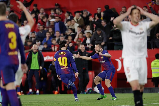 SEVILLA, SPAIN - MARCH 31: (L-R) Lionel Messi of FC Barcelona celebrates 2-2 with Jordi Alba of FC Barcelona  during the La Liga Santander  match between Sevilla v FC Barcelona at the Estadio Ramon Sanchez Pizjuan on March 31, 2018 in Sevilla Spain (Photo by David S. Bustamante/Soccrates/Getty Images)